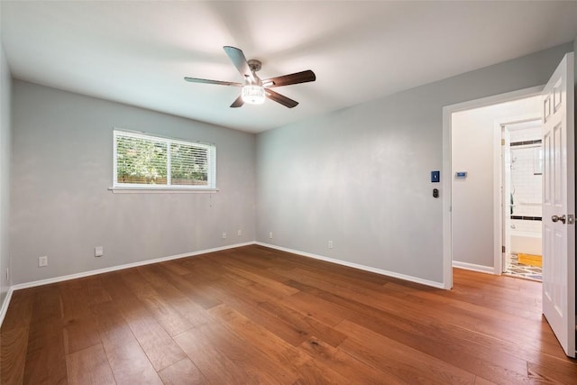 8500 Woodstone Dr, Austin, TX 78757 - unfurnished room with a ceiling fan and wood-type flooring