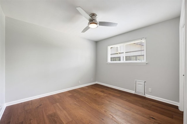 8500 Woodstone Dr, Austin, TX 78757 - unfurnished room featuring dark wood finished floors, baseboards, and ceiling fan
