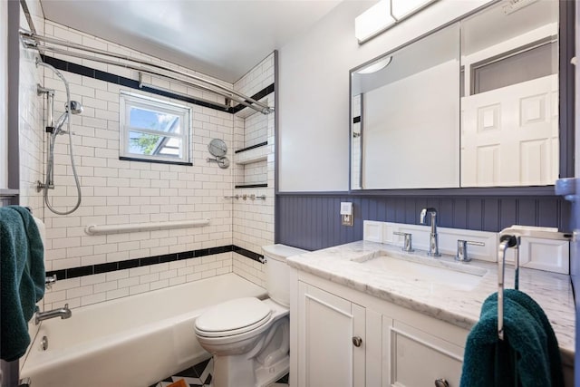 8500 Woodstone Dr, Austin, TX 78757 - full bathroom with toilet, vanity, bathing tub / shower combination, and wainscoting