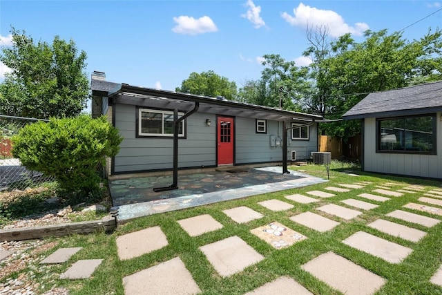 8500 Woodstone Dr, Austin, TX 78757 - view of front of house with a patio area and a chimney