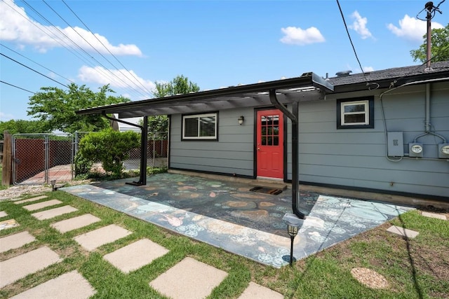 8500 Woodstone Dr, Austin, TX 78757 - view of front facade with a gate, a patio area, and fence
