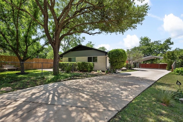 8500 Woodstone Dr, Austin, TX 78757 - view of front of home with brick siding and driveway