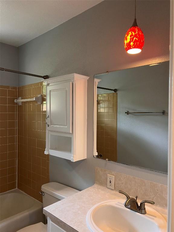 8500 Woodstone Dr, Austin, TX 78757 - full bathroom featuring vanity and  shower combination