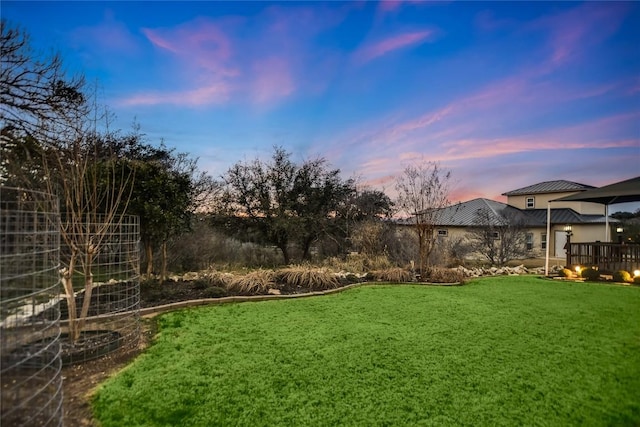 1310 Clayton Nolen, Horseshoe Bay, TX 78657 - yard at dusk with a lawn
