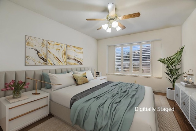 1310 Clayton Nolen, Horseshoe Bay, TX 78657 - bedroom featuring wood finished floors, a ceiling fan, and baseboards
