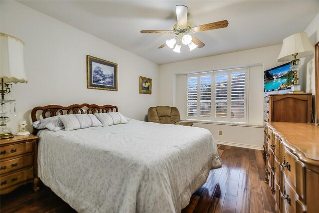 1310 Clayton Nolen, Horseshoe Bay, TX 78657 - bedroom with dark wood-style flooring, baseboards, and a ceiling fan