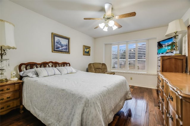 1310 Clayton Nolen, Horseshoe Bay, TX 78657 - bedroom featuring dark wood finished floors and ceiling fan