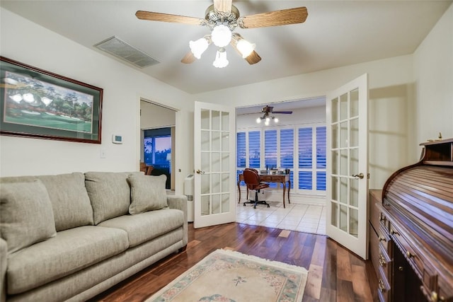 1310 Clayton Nolen, Horseshoe Bay, TX 78657 - living area featuring french doors, an office area, wood finished floors, and a ceiling fan