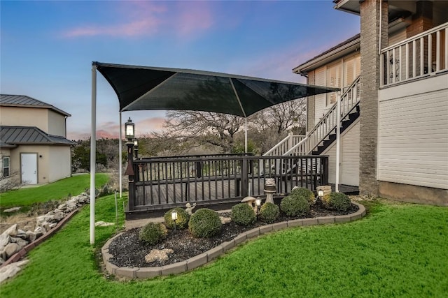 1310 Clayton Nolen, Horseshoe Bay, TX 78657 - yard at dusk featuring a yard and stairs
