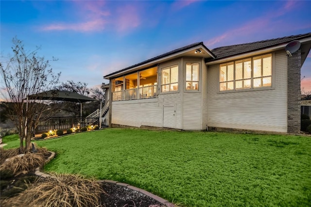 1310 Clayton Nolen, Horseshoe Bay, TX 78657 - view of home's exterior with a lawn and stairway