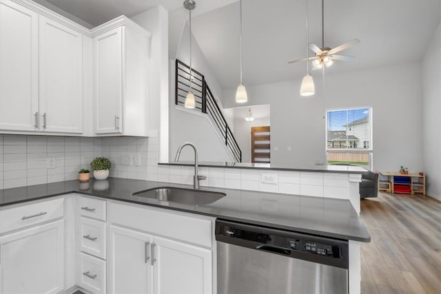 224 Backstays Loop, Kyle, TX 78640 - kitchen featuring dishwasher, a sink, dark countertops, tasteful backsplash, and a ceiling fan