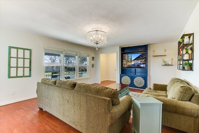 1312 N 8th St, Temple, TX 76501 - living room with a chandelier, baseboards, and dark wood-style floors
