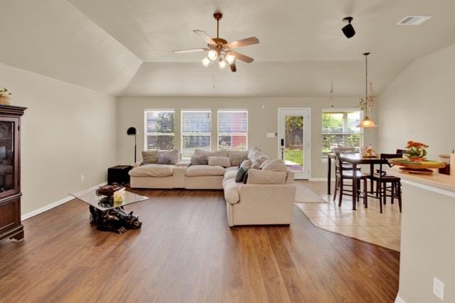 1040 Kensington Castle Trl, Pflugerville, TX 78660 - living room featuring a ceiling fan, lofted ceiling, and wood finished floors