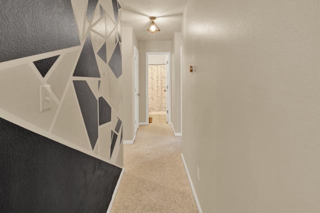1040 Kensington Castle Trl, Pflugerville, TX 78660 - hall with light colored carpet and baseboards
