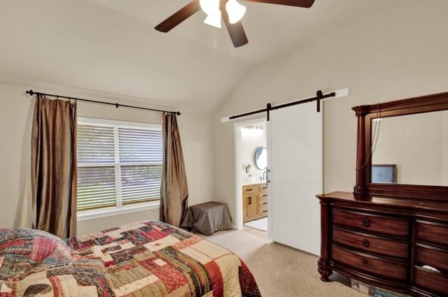 1040 Kensington Castle Trl, Pflugerville, TX 78660 - bedroom with a barn door, lofted ceiling, carpet, ceiling fan, and ensuite bathroom