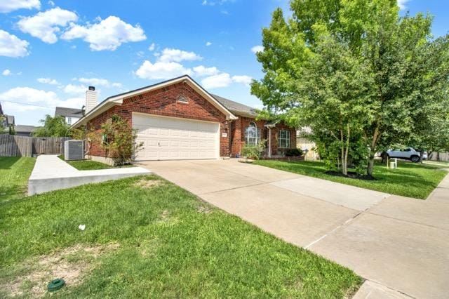 1040 Kensington Castle Trl, Pflugerville, TX 78660 - ranch-style house featuring a garage, brick siding, driveway, and a chimney