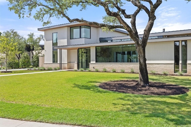 1604 Barclay Dr, Austin, TX 78746 - modern home featuring stone siding, stucco siding, and a front lawn