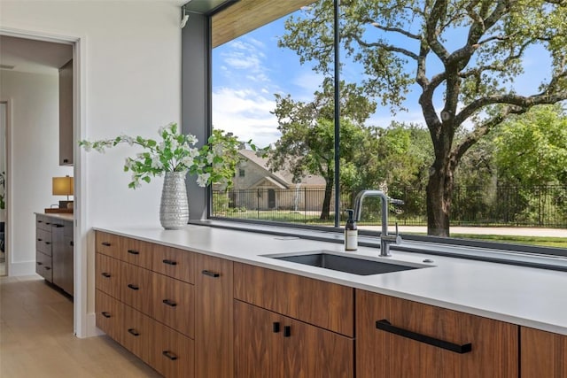 1604 Barclay Dr, Austin, TX 78746 - kitchen featuring a sink, light countertops, and modern cabinets
