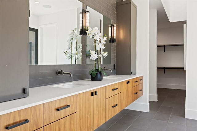 1604 Barclay Dr, Austin, TX 78746 - bathroom with double vanity, tile patterned floors, and backsplash