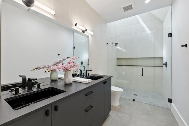 1604 Barclay Dr, Austin, TX 78746 - bathroom with a stall shower, toilet, tile patterned flooring, and double vanity