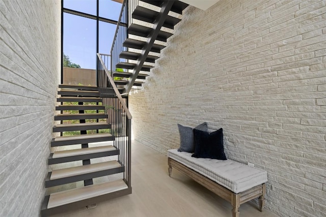1604 Barclay Dr, Austin, TX 78746 - staircase with a towering ceiling and wood finished floors
