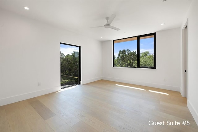 1604 Barclay Dr, Austin, TX 78746 - unfurnished room with plenty of natural light, light wood-style floors, baseboards, and recessed lighting