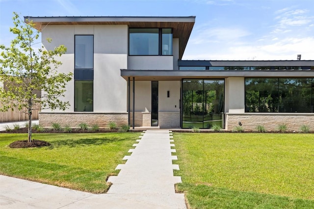1604 Barclay Dr, Austin, TX 78746 - contemporary house featuring stucco siding, a front lawn, and stone siding