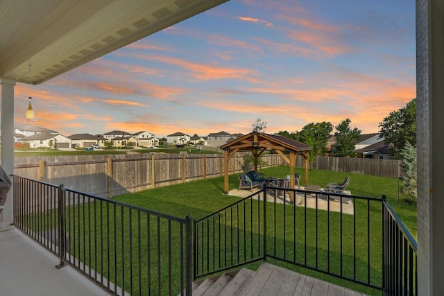 1116 View Dr, Georgetown, TX 78628 - yard at dusk with a residential view, a gazebo, and a fenced backyard