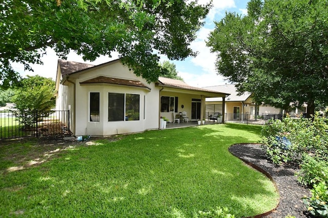101 Scurry Pass, Georgetown, TX 78633 - rear view of property with stucco siding and a patio area