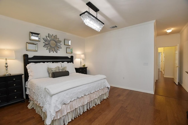 101 Scurry Pass, Georgetown, TX 78633 - bedroom featuring wood finished floors, ornamental molding, and baseboards