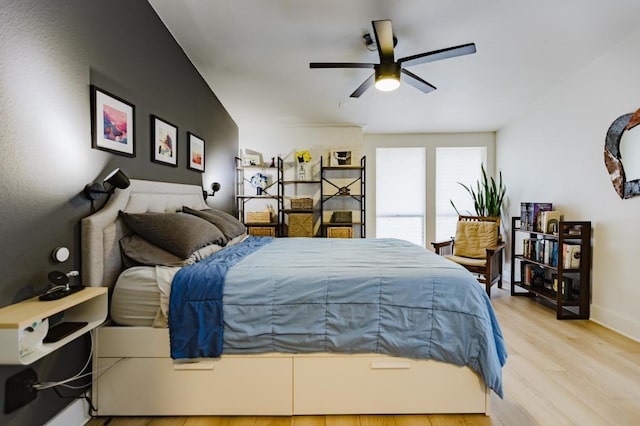 909 Reinli St Unit 102, Austin, TX 78751 - bedroom with wood finished floors and ceiling fan