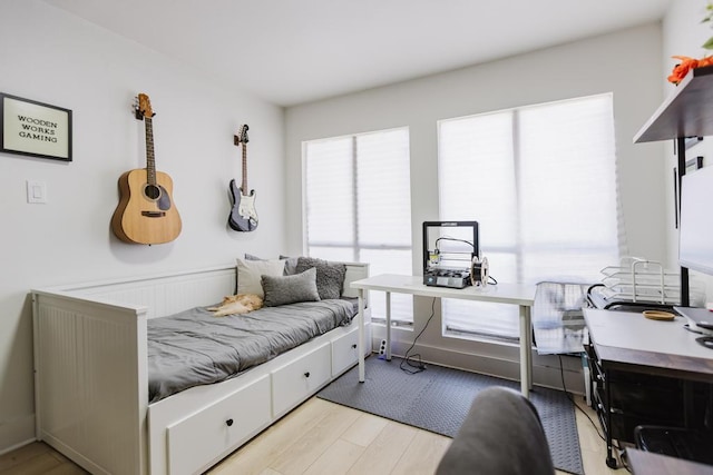 909 Reinli St Unit 102, Austin, TX 78751 - bedroom with an office area and wood finished floors