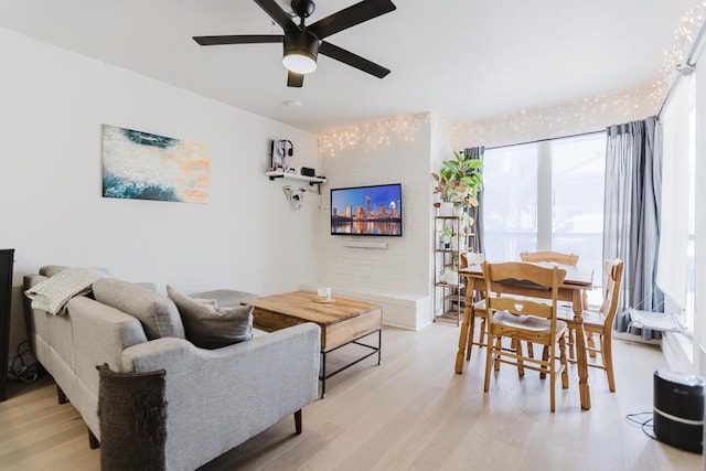 909 Reinli St Unit 102, Austin, TX 78751 - living area with a ceiling fan and light wood-type flooring