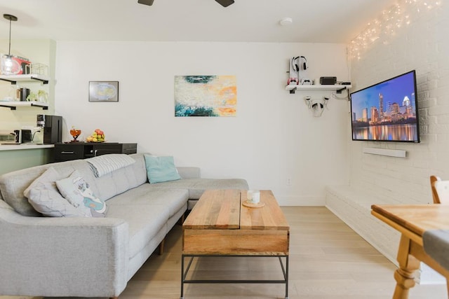 909 Reinli St Unit 102, Austin, TX 78751 - living area with a ceiling fan and light wood finished floors