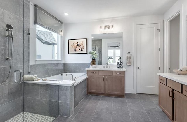 100 Trans Pecos Ct, Georgetown, TX 78628 - full bath with two vanities, plenty of natural light, and a stall shower
