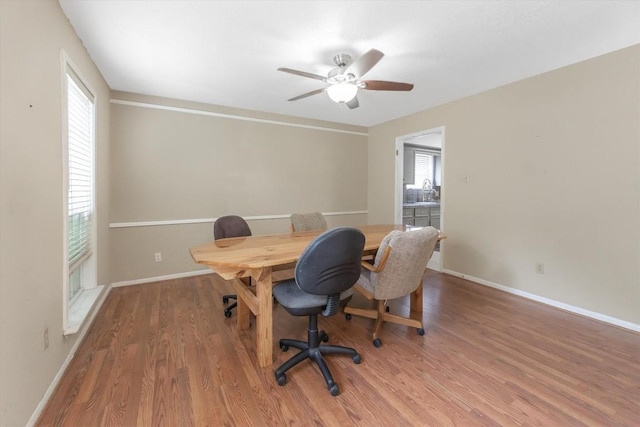 5519 Coon Tree Ct, Humble, TX 77346 - home office featuring plenty of natural light, wood finished floors, a ceiling fan, and baseboards