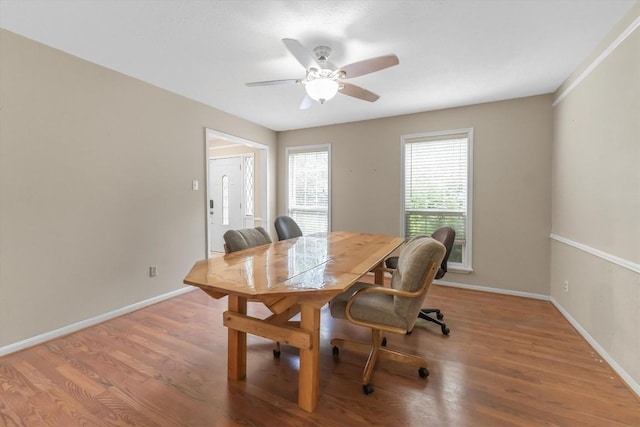 5519 Coon Tree Ct, Humble, TX 77346 - dining area featuring wood finished floors, a ceiling fan, and baseboards