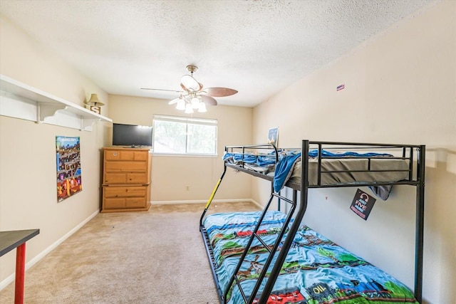 5519 Coon Tree Ct, Humble, TX 77346 - bedroom with carpet, a textured ceiling, ceiling fan, and baseboards