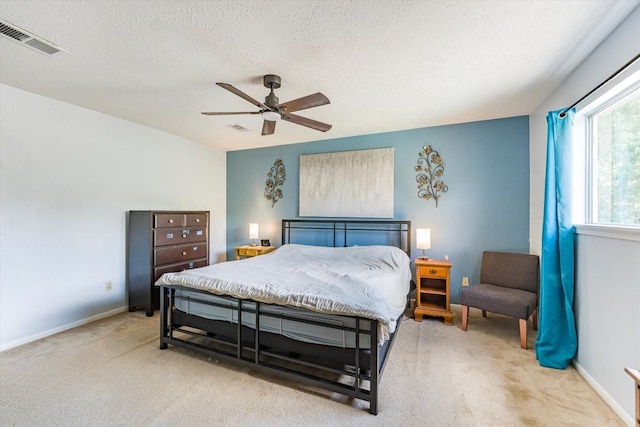5519 Coon Tree Ct, Humble, TX 77346 - carpeted bedroom featuring a textured ceiling, ceiling fan, and baseboards