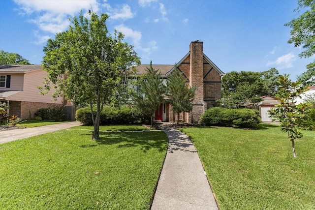 5519 Coon Tree Ct, Humble, TX 77346 - view of front facade featuring brick siding, a front lawn, a chimney, and concrete driveway