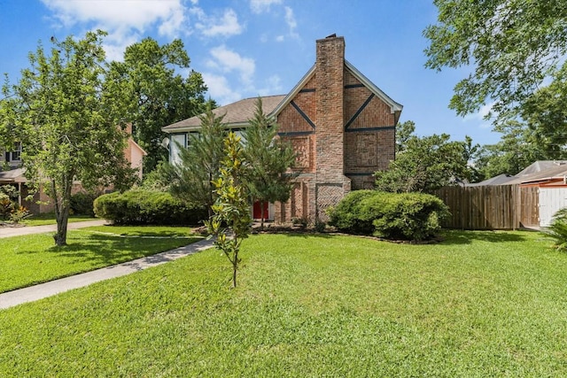 5519 Coon Tree Ct, Humble, TX 77346 - tudor home with a chimney and brick siding