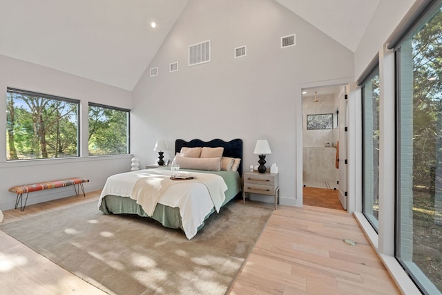 1769 Parten Ranch Pkwy, Austin, TX 78737 - bedroom featuring high vaulted ceiling, light wood finished floors, recessed lighting, ensuite bath, and baseboards
