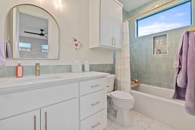 1769 Parten Ranch Pkwy, Austin, TX 78737 - bathroom featuring tile patterned floors, ceiling fan, vanity, toilet, and tile walls