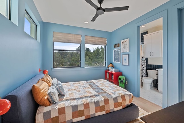 1769 Parten Ranch Pkwy, Austin, TX 78737 - bedroom with wood finished floors, recessed lighting, ceiling fan, and ensuite bath