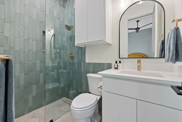 1769 Parten Ranch Pkwy, Austin, TX 78737 - bathroom featuring a stall shower, toilet, vanity, and tile patterned flooring