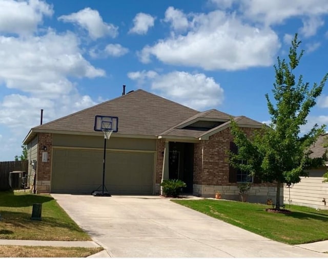 view of front facade featuring a garage, brick siding, driveway, and central air condition unit