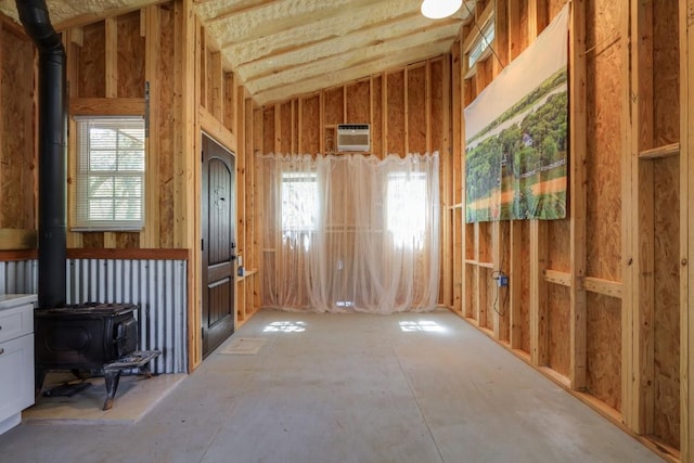 203 Hickory Dr, Sheridan, TX 77475 - misc room featuring a wood stove and a wall mounted AC