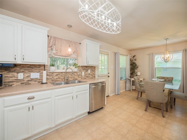 107 Wisteria Way, San Marcos, TX 78666 - kitchen featuring dishwasher, a chandelier, a sink, decorative backsplash, and white cabinetry