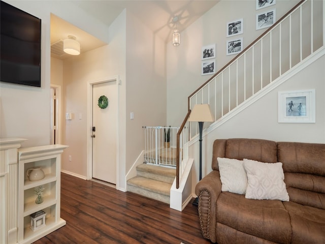 107 Wisteria Way, San Marcos, TX 78666 - entrance foyer featuring dark wood-style floors, stairs, and baseboards