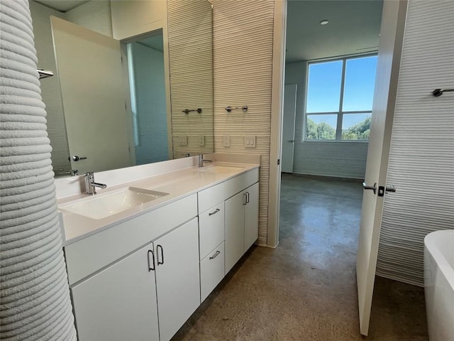 120 Rough Creek Rd, Georgetown, TX 78628 - bathroom featuring double vanity, concrete flooring, and a tub to relax in